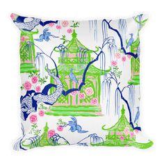 a decorative pillow with birds and flowers on the front in green, pink and blue