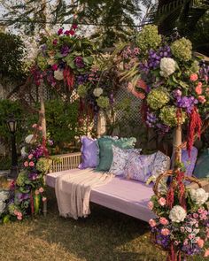 a white bench covered in lots of flowers