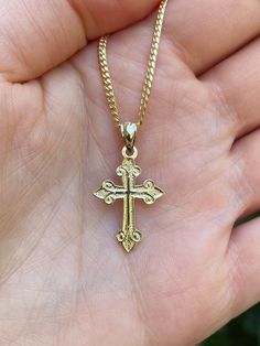 Beautiful 14k yellow gold  cross pendant.  Material: 14k solid yellow gold. Length: Approximately 1 inch long. Width: Approximately .25" wide. Weight: Approximately 1.3 grams.  Comes in a nice box. *Chain is sold separately. Chain typically weighs 5-7 grams depending on length chosen. It is a 14k gold Miami Cuban 2mm. 14k Gold Cross Necklace For First Communion, Yellow Gold Cross Necklace For First Communion, Yellow Gold Cross Charms For Baptism, Yellow Gold Cross Pendant For First Communion, Yellow Gold Cross For Baptism, Engraved Yellow Gold Crucifix Jewelry, Spiritual 14k Gold Cross Jewelry, Yellow Gold Cross Pendant For Baptism, Yellow Gold Cross Necklaces For Baptism