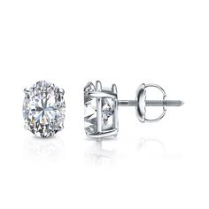 These exquisite lab grown diamond stud earrings feature a 4-prong basket setting in a glistening 14k white gold metal. The studs include dazzling Oval-cut lab grown diamonds with a total weight of 1.65 ct. and are available with push-back, screw back . Diamond Studs Earrings, Black Diamond Pendant, Black Diamond Studs, Halo Diamond Earrings, Solitaire Diamond Pendant, Colored Diamond Rings, Basket Setting, Halo Earrings, Black Diamond Ring