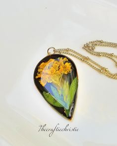 Real Flower Jewelry-Pressed Flower Jewelry-Resin Jewelry-Pressed Flower Necklace-Alyssum Jewelry-Boho Jewelry-Boho Necklace-Gift for Her by Thecraftiechristie on Etsy Bohemian Birth Flower Necklaces, Bohemian Yellow Necklace With Flower Charm, Bohemian Gold Resin Necklace, Bohemian Flower Shaped Resin Jewelry, Bohemian Flower-shaped Resin Jewelry, Bohemian Jewelry With Pressed Flowers In Resin, Bohemian Necklace With Pressed Flowers, Bohemian Green Jewelry With Pressed Flowers, Magical Necklace