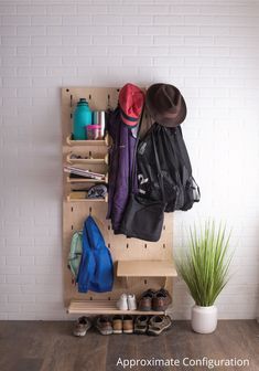 there is a coat rack with hats and bags on it, along with other items