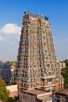 an elaborately decorated tower in the middle of a city