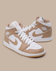 Simple in blocking, the colorway lays a foundation of white leathers, pairing it with a matching lace unit, collar, and Wings logo. Over top, the tanned leathers come into play, adding a premium look and feel that suits the gum bottom quite well. Tap in to see if we have these in your size. Nike Shoes Girls, Nike Fashion Shoes, Preppy Shoes, Jordan Shoes Girls, Jordan Shoes Retro, All Nike Shoes, Cute Nike Shoes, Cute Sneakers, Fresh Shoes