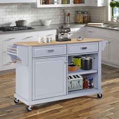 a kitchen island cart with wooden top on wheels