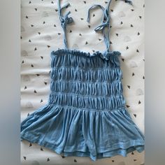 Sky Blue Babydoll Top With Adjustable Tie Straps. Never Worn Before So Great Condition Can Be Washed And Steamed Upon Request Before Shipping! Blue Cotton Tank Top With Ruffles, Blue Ruffled Tops For Playwear, Light Blue Fitted Tops For Playwear, Blue Summer Tank Top For Playwear, Light Blue Tops For Spring Playwear, Light Blue Tops For Playwear In Spring, Casual Blue Tank Top For Playwear, Blue Ruffled Tops For Loungewear, Blue Tank Top For Spring Playwear