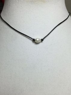 These are very popular right now.  Single pearl necklace on a leather cord. Adjustable Classic Pearl Choker Necklace, Adjustable Single Strand Pearl Choker, Adjustable Pearl Drop Choker Necklace, Minimalist Adjustable Pearl Choker Necklace, Single Pearl Necklace, Leather Choker Necklace, Single Pearl, Pearl Leather, Leather Chokers