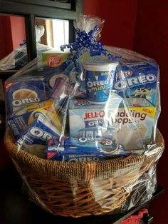 a basket filled with ice cream and snacks