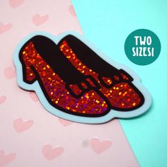 ❤ WHAT YOU GET ❤ A sparkly ruby slipper sticker that glitters with each turn in the light--glossy die cut waterproof vinyl sticker, protected with UV coating. The perfect addition to any laptop, water bottle, bike helmet--wherever your heart desires! This sticker is meant to last. I was always mesmerized by Dorothy's magic slippers in the Wizard of Oz and wanted to create a sticker to bring that magic to your everyday. The red ink lets the big dust sparkle vinyl shine--it looks a little different every time you see it!  SHIPPING: Please note that USPS First Class mail has been *especially* slow lately. Please upgrade to Priority if you need a more reliable delivery date and tracking. SIZE OPTIONS: 3 inches wide (Small), 4.75 inches wide (Large) MATERIAL: Durable shiny vinyl, waterproof, wi Wizard Of Oz Dorothy, Create A Sticker, Magic Shoes, Ruby Slippers, Sparkle Shoes, Glitter Dust, Slippers Shoes, Sticker Laptop, Bike Helmet