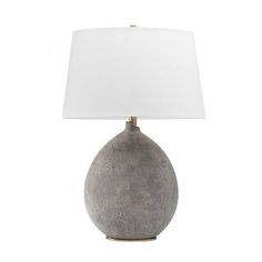 a gray table lamp with a white shade