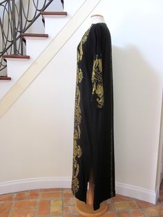 Addl. Photos? Questions? Please convo MEASUREMENTS: Bust: 42 Waist: 44 Hip: 45 Length: 55 Sleeve: 21 1/2 from nat'l shoulder SIZE: Fits like a modern Medium. There is no size label. FEATURES: Exotic vintage caftan is hand woven from a heavy weight black cotton, with gold metallic embroidery. This beauty slips over your head for poolside glamour or an evening in the boudoir or out to dinner. No lining, thick and opaque. Both sideseams have slits to about knee height. FABRIC: 100% cotton (gold emb Black Caftan, Poolside Glamour, Embroidered Caftan, Bonnie Cashin, Metallic Embroidery, Bridal Bag, Palm Beach Fl, Suede Dress, Gold Embroidery