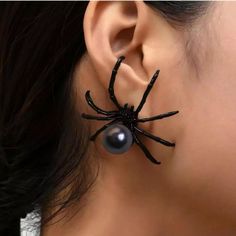 Get ready to elevate your Halloween style with our spooky Spider Halloween Earrings! These eye-catching accessories feature intricate spider designs that are perfect for adding a playful touch to your festive outfits. Made from lightweight materials, they're comfortable to wear all night long--whether you're at a party or trick-or-treating. The shimmering details catch the light beautifully, making them a conversation starter wherever you go. Plus, they're versatile enough to wear beyond Halloween! Embrace the spirit of the season and show off your fun side with these charming earrings. Don't miss out--grab your pair and make a statement this Halloween! Pearl Spider, Spider Insect, Festive Outfits, Spider Halloween, Spooky Spiders, Elegant Halloween, Halloween Style, Halloween Theme, Halloween Spider