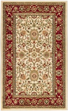 a red and white rug with an ornate design on the bottom, in front of a white background