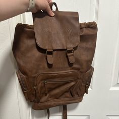 Mossimo Brown Faux Leather Backpack W Zipper Pockets - Perfect Condition, Never Used - Brown Faux Leather With Brass Looking Accents - Zipper Pockets - Cinchable Large Pocket And Snap Top Flap - Adjustable Straps - Zipper Pocket & Open Pockets Inside Brown Faux Leather Backpack With Zipper Closure, Brown Faux Leather Backpack For On-the-go, Casual Faux Leather Rectangular Backpack, Casual Rectangular Faux Leather Backpack, Casual Faux Leather Backpack For School, Casual Faux Leather School Backpack, Trendy Faux Leather Backpack With Zipper Pocket, Trendy Brown Leather Backpack With Zipper Closure, Casual Faux Leather Backpack For Travel