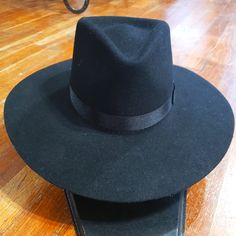 This Is A Cute Black Felt Hat With A Black Ribbon Band Classic Black Felt Hat For Rodeo, Adjustable Black Top Hat For Winter, Black Fedora With Flat Crown For Fall, Classic Black Adjustable Fedora, Black Western Felt Hat With Flat Crown, Western Black Felt Hat With Flat Crown, Black Felt Hat With Flat Crown For Fall, Classic Black Hat With Flat Crown, Fitted Black Felt Hat For Country Events