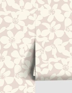 a wallpaper with white flowers on it and a light pink background that has been cut in half