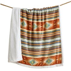 an orange and white towel hanging on a clothes line