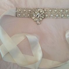 Satin Bridal Sash Pearls & Rhinestones W Pendant Missing One Rhinestone Elegant White Sashes With Rhinestones, White Crystal Bridal Belt For Party, Elegant Bedazzled Wedding Sash, Elegant Embellished White Bridal Belt, White Crystal Sash For Formal Occasions, White Crystal Embellished Sash, White Embellished Crystal Sashes, White Crystal Embellished Sashes, White Crystal Sashes For Formal Occasions