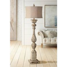 a living room scene with focus on the floor lamp