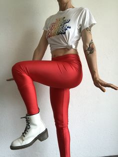 "Vintage leggings by Leonard , Model : Marius Made in Italy. 1980 Bright red leggings in shiny strech. High waist . Label of brand inside and original cardboard labels are present. Deadstock item.. In perfect condition. 80% Nylon 20% Elastam Size 2 Model wears usually size S (36/38) and measures 170cm / 66,8\" Flat measurements (without streching) : Size 2: Waist: 36cm - 14,1\" Hips: 40cm - 15,7\" Crotch: front: 29cm - 11,4\" rear: 33cm - 12,9\" Length: 98cm - 38,5\" Inseam: 75cm - 29,5\" Thighs Red Stretch Footless Bottoms, Red Full-length Leggings For Party, Red Full Length Leggings For Party, Red Tight Full-length Leggings, Red Stretch Retro Bottoms, Red Retro Stretch Bottoms, Red High Stretch Bottoms For Party, High Stretch Red Bottoms For Party, High Stretch Red Party Bottoms