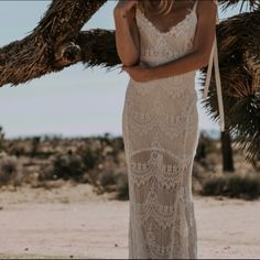 Boho See-Through Lace Sheath Wedding Dress Stunning! This Dress Is Brand New, Never Worn, And Never Altered. (Note: The Front Buttons Were Professionally Removed When Originally Purchased From Designer.) Otherwise, It Is In New, Unused Condition. Size: Large (Fits Approx. 8-12) From The Designer: The “O’keeffe”, A Backless Lace Bohemian Wedding Dress. Beginning With An Ivory Satin Liner On The Bodice With An Ivory Eyelash Lace Overlay, And A Soft Chiffon Lining Throughout The Skirt. This Gown Fe Beach Wedding Dress With Lace Back And Fitted Bodice, Fitted Sleeveless Wedding Dress For Beach Wedding, Elegant Beach Wedding Dress With Lace Back, Delicate Lace Floor-length Wedding Dress, Elegant Dress With Lace Back For Beach Wedding, Fitted Wedding Dress With Delicate Lace, Beach Wedding Dress With Delicate Lace Fitted, Fitted White Lace Dress For Beach Wedding, Fitted Delicate Lace Wedding Dress