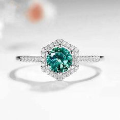 An Art - deco Mint Green Sapphire ring handmade in solid white gold. The center Hexagon Mint Green Sapphire is 5x5mm and 1.00ct surrounded by 1.5mm round diamonds on a diamond fitted band. ✯ ✯✯ Free UK and USA shipping ✯✯ ✯ ✯✯ ✯ No Custom Charges for USA orders ✯✯ ✯ If you have any additional questions about this item, just hit the "Ask a Question" button (just to the right of the price) and I will get back to you within 24 hours.  MADE TO ORDER  Please allow 2 to 3 weeks to make this ring. Rush Fancy Color Diamond Ring, Green Sapphire Engagement, Green Sapphire Engagement Ring, Green Sapphire Ring, Saphir Ring, Round Diamond Ring, Art Deco Engagement, Beautiful Engagement Rings, Deco Engagement Ring