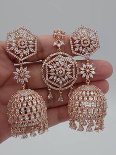 Jhumki and Tika sets are the ultimate in versatile Indian Jewelry. Wear the set together or, Maang Tika and Jhumki on their own to create three different looks. This Jhumki and Tikka set has intricate detailed American Diamond Cubic Zirconia. Dimension:  Jhumki: L7.5xW2.5cm TIKKA: L12XW2.5cm Aproxx We try to take photos as naturally as we can, but color can be slightly vary due to lighting.  Jewelry Care -- Keep all the jewelry away from water, perfumes, and other harsh chemicals Please note: No Returns No Exchange. But If you have any issue with your order, Kindly contact us before leaving a review Pakistani Jewelry Sets Simple, Indian Tikka Jewelry, Indian Earrings Jhumka, Desi Jewellery, Tikka Jewelry, Pakistani Earrings, Maang Tika, Indian Wedding Jewelry Sets, Jewelry Pakistani