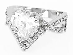 Bella Luce® white diamond simulant 6.23ctw round and heart rhodium over sterling silver heart ring. Measures approximately 0.88"L x 0.56"W and is not sizable. The diamond equivalent weight is 3.77ctw. White Cubic Zirconia Heart Ring, Heart Shaped White Ring With Vvs Clarity, White Heart Ring With Accent Stones For Promise, White Rings With Accent Stones For Valentine's Day, White Heart Cut Jewelry With Center Stone, White Heart Ring With Diamond Accents For Valentine's Day, White Heart Cut Brilliant Ring, White Heart Cut Jewelry With Accent Stones, Valentine's Day White Rings With Vs Clarity