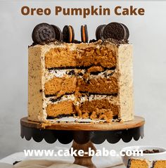 an oreo pumpkin cake with cookies on top and the words, oreo pumpkin cake