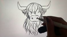 a drawing of a bull's head is shown in black and white with a marker