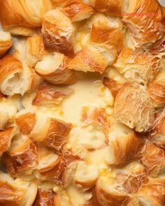 croissants with melted cheese on top in a casserole dish, ready to be eaten