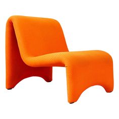 an orange chair and footstool sitting next to each other