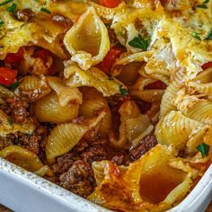 a casserole dish filled with pasta and meat