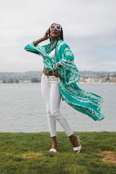 This tie-dye print kimono was handmade in San Diego, CA with a machine washable, ultra luxe, semi-sheer chiffon. Featuring pockets and a matching waist tie, you can style this piece in at least 10 ways! Machine wash cold, gentle, and hang dry. Size Chart: S: 0/6 M: 8/10 L: 12/14 XL: 16/18 XXL: 20/22 Summer Silk Kimono With Tie Waist, Spring Festival Cover-up With Tie Waist, Spring Tie Dye Kimono With Kimono Sleeves, Spring Bohemian Hand Dyed Kimono, Bohemian Hand Dyed Kimono For Spring, Spring Bohemian Hand-dyed Kimono, Bohemian Hand-dyed Kimono For Spring, Long Tie Dye Kimono For Summer, Spring Festival Tie Dye Kimono