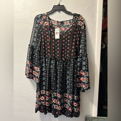 Long Sleeve Sheer Dress With Black Slip Underneath. Black Mini Dress For Beach In Fall, Black Printed Mini Dress For Fall, Flowy Black Dress For Fall, Black Printed Long Sleeve Dress, Casual Flowy Black Dress, Black Printed Dress For Fall, Black Fall Vacation Dresses, Printed Black Midi Dress For Fall, Flowy Black Midi Dress For Vacation