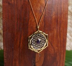 Flower of life necklace with padma and amethyst stone can be adjusted in length. Material : Brass, White Brass, amethyst stone,string Material of padma : Brass Material flower of life : white Brass Weight : 10 gram Height of pendant : 1.8 inches Width of pendant : 1.5 inches Ship wordwide from Ubud, Bali, Indonesia Spiritual Amethyst Necklaces With Adjustable Chain, Spiritual Amethyst Round Pendant Necklace, Spiritual Amethyst Necklace With Adjustable Chain, Spiritual Amethyst Pendant Necklace, Purple Amethyst Amulet Necklaces, Amethyst Amulet Necklace For Meditation, Purple Amethyst Amulet Necklace, Holistic Amethyst Gemstone Jewelry, Amethyst Gemstone Amulet Necklace