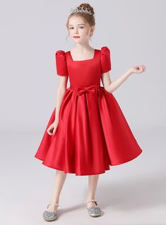 Domineering in its elegance, this flower girl dress is crafted to make your little one feel truly special. The dress features a striking red satin fabric that exudes luxury and sophistication. The square neckline and puff sleeves offer a timeless look, while the fitted bodice and decorative bow at the waist add a charming touch. The skirt flows into a full, tea-length design, crafted from layers of soft satin that move gracefully with every step. The vibrant red hue of the dress is both bold and versatile, making it an excellent choice for various wedding themes and formal events. Constructed from premium materials, this dress ensures comfort and durability, allowing your flower girl to move with ease and confidence throughout the day. The hidden zipper at the back provides easy dressing a Prom Dresses Burgundy, Hi Friend, Ombre Prom Dresses, Prom Dresses Elegant, Velvet Prom Dress, Professional Dress, Long Sleeve Prom, Two Piece Homecoming Dress, Burgundy Prom Dress