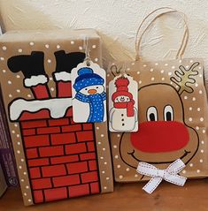 three bags decorated to look like christmas characters