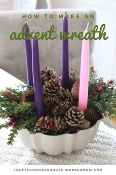 a white bowl filled with pine cones and purple candles