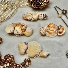 Welcome to our seaside-inspired collection of Shell Hair Clips! 🐚 Perfect for adding a touch of coastal charm to any hairstyle, these exquisite hair clips are a must-have accessory for Bridal Showers, Weddings, Beach-goers, and anyone seeking those quintessential summer vibes. Crafted with love and attention to detail, each hair clip varies in size and are made with natural shells. No two hair clips are alike, making each piece a unique treasure to be cherished. Please feel free to send me a message if you would like the exact dimensions of this hair clip.  Whether you're attending a beachside wedding, strolling along the shore, or simply want to infuse your everyday look with a touch of oceanic elegance, these Shell Hair Clips are sure to make a splash. Embrace the beauty of the sea and Shells In Hair, Seashell Hair Clips Diy, Wedding Hair Beach, Sea Shell Hair Accessories, Seashell Hair Pins, Shell Hair Clips, Seashell Claw Clip, Seashell Hairclip, Sea Shell Hair Clip