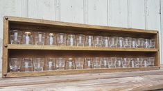 "Shot glass display - 36\" long Shot glass display is long enough to hold many sized shot glasses. Can be mounted to the wall and the hardware is included. Can also be used to hold and display essential oils. - Color shown is \"honey\" - Other options available. Add a small ledge to stop items falling off: https://www.etsy.com/listing/546553791 Add a beeswax coating: https://www.etsy.com/listing/260805496 Mounting hardware included Length: 36\" Height: 10.5\" (2 Row) Depth: 2.25\" (2\" if you ad Wall Covering Ideas Panelling, Shot Glass Display, Essential Oil Display, Oil Display, Shot Glass Holder, Essential Oil Holder, Wall Light Shades, Vanity Wall Mirror, Kitchen Wall Colors