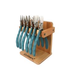 a set of blue handled knives in a wooden holder