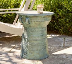 a small table sitting on top of a cement slab