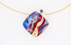 This unique cloisonné enamel pendant is hand fabricated with enamel, fine silver, 22k and 24k gold, a 4 mm round faceted kyanite, and is backed with sterling silver. A 1.25 mm 14 k gold-plated sterling silver omega chain with friction clasp is included. Each piece is made by hand and colors may vary Cloisonne Enamel Jewelry, Wire Jewelry Patterns, Klimt Art, Beaded Jewelry Earrings, Red Ocean, Pendant Bails, Cloisonne Enamel, Enamels, Enamel Jewelry