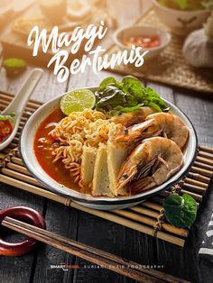 a white plate topped with noodles and shrimp next to chopsticks