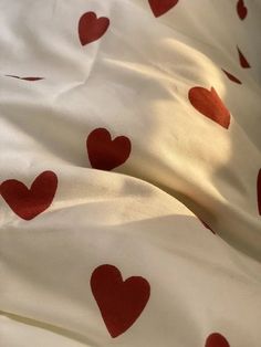 the sheets have red hearts on them