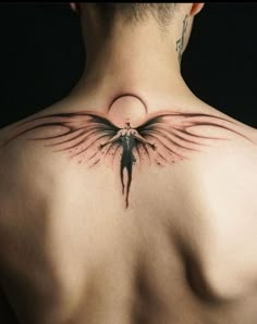 a man with an angel tattoo on his back