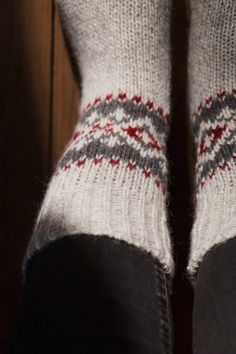 "Hand knitted unisex socks are inspired by minimalist Scandinavian style. Nordic ornaments, organic wool will keep your feet nice & warm. Sustainable wool yarns socks designed to be worn with shoes and boots. Ideal to wear during active outdoor time while walking, hiking. Durability Ideal for chilly autumn, winter weather. This year we are inviting customers to buy Christmas presents from small family businesses & stand together during this crazy time. Handmade Christmas presents will be Cozy Wool Socks For Winter, Nordic Socks, Cozy Red Winter Socks, Nordic Knitted Winter Socks, Nordic Warm Winter Socks, Handmade Christmas Presents, Woolen Clothes, Woolen Socks, Sweater Bags