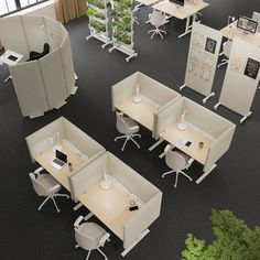 an office cubicle with desks and chairs in the middle of it is shown