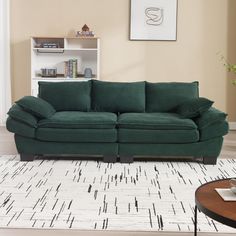 a green couch sitting on top of a white rug